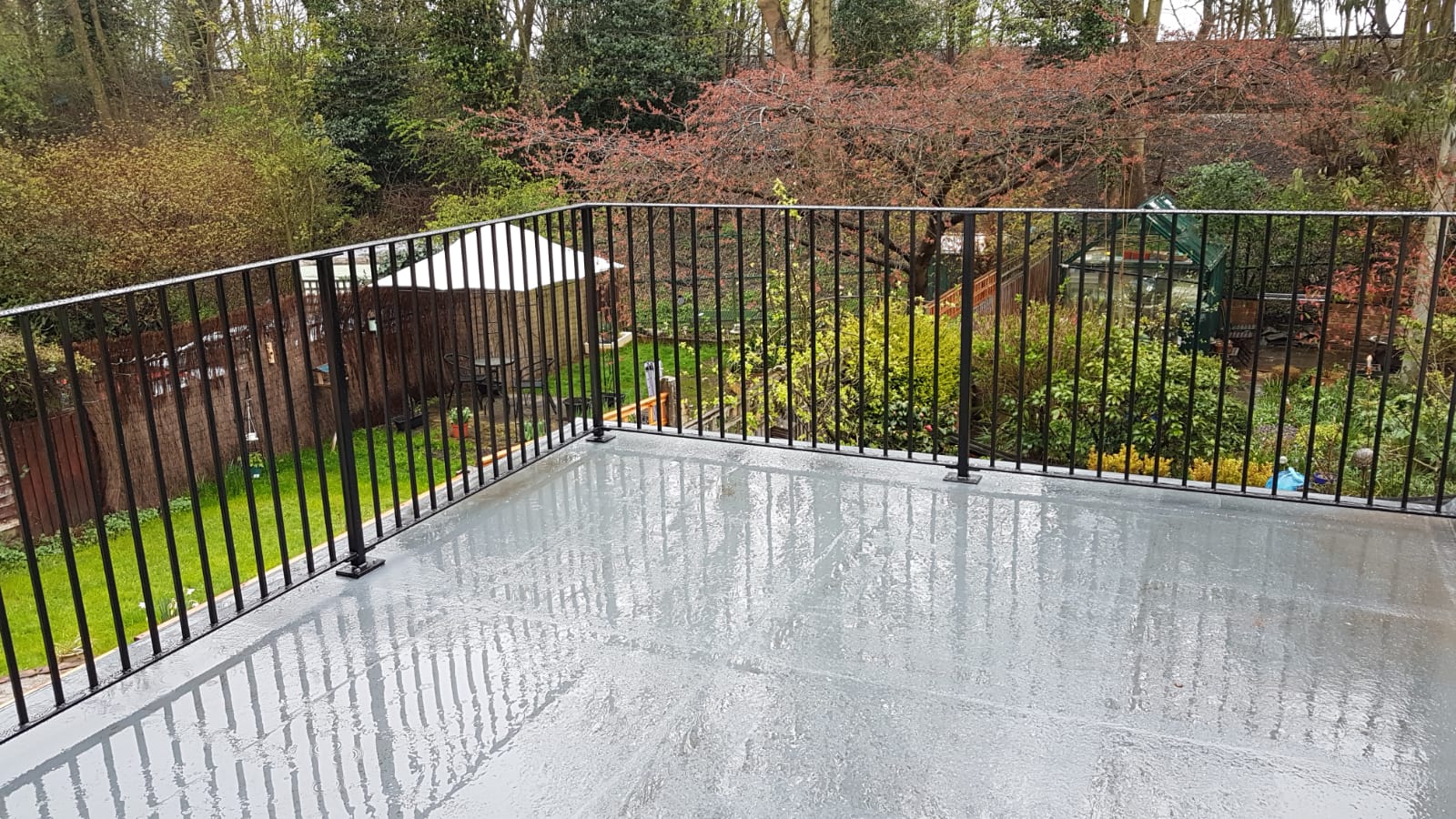 Black steel terrace balustrade on a flat roof, Epping, Essex